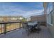Back deck with table and seating overlooks landscaped yard at 318 Lantana Ln, Woodstock, GA 30188