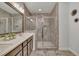 Modern bathroom features a glass-enclosed shower and double sink vanity at 318 Lantana Ln, Woodstock, GA 30188
