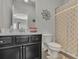 Bathroom featuring a patterned shower curtain and dark vanity at 318 Lantana Ln, Woodstock, GA 30188