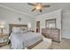 Bedroom with a comfortable bed, wood furniture, and soft, neutral tones at 318 Lantana Ln, Woodstock, GA 30188