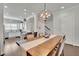 Dining area with modern lighting is open to a bright modern kitchen at 318 Lantana Ln, Woodstock, GA 30188