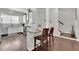 Spacious kitchen featuring a breakfast bar, stainless steel appliances, and an open view of the staircase at 318 Lantana Ln, Woodstock, GA 30188