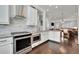 Open concept kitchen features granite countertops and stainless steel appliances at 318 Lantana Ln, Woodstock, GA 30188