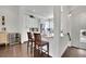 Bright kitchen with white cabinets, granite countertops, and stainless appliances at 318 Lantana Ln, Woodstock, GA 30188