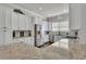 Bright kitchen features granite counters, stainless steel appliances and white cabinets at 318 Lantana Ln, Woodstock, GA 30188