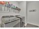 Modern laundry room featuring a washer and dryer at 318 Lantana Ln, Woodstock, GA 30188