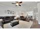 Open living room with dark hardwood floors, ceiling fan, and neutral colors at 318 Lantana Ln, Woodstock, GA 30188