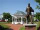 Charming gazebo in a serene public park featuring a bronze statue and well-manicured lawns for relaxation at 318 Lantana Ln, Woodstock, GA 30188