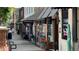 Street view of businesses and sidewalks with pedestrians walking at 318 Lantana Ln, Woodstock, GA 30188