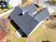 Aerial shot of the home with a gray roof and a blooming tree at 3412 Hard Creek Ln, Buford, GA 30519