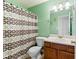 Cozy bathroom features a tub/shower combo and decorative accents at 3412 Hard Creek Ln, Buford, GA 30519