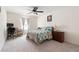 This bedroom features a ceiling fan, neutral walls, and comfortable carpet at 3412 Hard Creek Ln, Buford, GA 30519