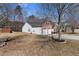 A two-story home with a two-car garage and a well-manicured lawn at 3412 Hard Creek Ln, Buford, GA 30519