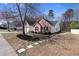 Charming brick home with landscaped front yard and a two-car garage at 3412 Hard Creek Ln, Buford, GA 30519