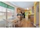 Bright kitchen showcases natural wood cabinets, stainless steel appliances, and a cozy breakfast nook at 3412 Hard Creek Ln, Buford, GA 30519