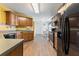 Open kitchen boasts stainless steel appliances, wood cabinets, and plenty of counter space for meal preparation at 3412 Hard Creek Ln, Buford, GA 30519