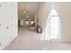Bright, airy living room with vaulted ceilings, large windows, and neutral carpeting at 3412 Hard Creek Ln, Buford, GA 30519