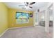 Carpeted living room with large window letting in natural light at 3412 Hard Creek Ln, Buford, GA 30519