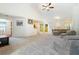 Spacious open-concept living room with vaulted ceiling and carpet at 3412 Hard Creek Ln, Buford, GA 30519