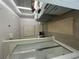 Modern bathroom features a glass enclosed shower, double sinks, and neutral tile flooring at 11555 Kimberly Way # 19, Hampton, GA 30228
