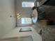 Bright dining area with stylish lighting, a comfortable banquette, and views of the outside at 11555 Kimberly Way # 19, Hampton, GA 30228