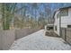 Backyard features gravel landscaping and a fence for added privacy at 1555 Sunnybrook Farm Rd, Atlanta, GA 30350