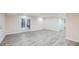 Spacious finished basement area featuring modern flooring and a walkout to the backyard at 1555 Sunnybrook Farm Rd, Atlanta, GA 30350