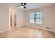 Sunlit bedroom features wood floors and closet space at 1555 Sunnybrook Farm Rd, Atlanta, GA 30350