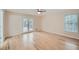 Bright bedroom with hardwood floors, neutral walls, and glass doors to a deck at 1555 Sunnybrook Farm Rd, Atlanta, GA 30350