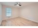 Cozy bedroom with wood floors, a ceiling fan, and natural light at 1555 Sunnybrook Farm Rd, Atlanta, GA 30350