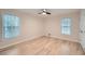 Well-lit bedroom with hardwood floors and two windows providing natural light at 1555 Sunnybrook Farm Rd, Atlanta, GA 30350