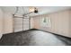 Clean and spacious garage with rubber tile flooring and paneled walls at 1555 Sunnybrook Farm Rd, Atlanta, GA 30350