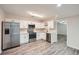 Modern kitchen features stainless steel appliances, white cabinets, and plenty of countertop space at 1555 Sunnybrook Farm Rd, Atlanta, GA 30350