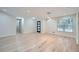 Bright, open-concept living area with hardwood floors, recessed lighting, and a stylish front door at 1555 Sunnybrook Farm Rd, Atlanta, GA 30350