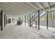 Covered patio area with room for seating, complemented by a staircase and a serene outdoor view at 1555 Sunnybrook Farm Rd, Atlanta, GA 30350
