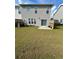 Backyard featuring lush lawn, small patio and privacy fence at 2560 Quarterdeck Dr, Cumming, GA 30041
