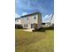 Backyard featuring lush lawn, small patio and privacy fence at 2560 Quarterdeck Dr, Cumming, GA 30041