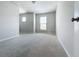 Spacious bedroom with a view from the doorway featuring neutral walls, trim, and plush carpeting at 2560 Quarterdeck Dr, Cumming, GA 30041