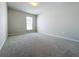 Bright bedroom featuring a neutral color palette, plush carpeting, and a window with blinds at 2560 Quarterdeck Dr, Cumming, GA 30041