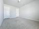 Spacious bedroom with neutral carpet and doors at 2560 Quarterdeck Dr, Cumming, GA 30041
