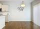 Dining area features modern lighting, butterfly artwork, and a large window with bright natural light at 2560 Quarterdeck Dr, Cumming, GA 30041