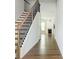 Bright foyer features hardwood floors, staircase, and access to the home's inviting living space at 2560 Quarterdeck Dr, Cumming, GA 30041