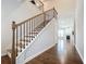 Beautiful foyer with hardwood floors, a staircase, and an inviting entry into the living room at 2560 Quarterdeck Dr, Cumming, GA 30041
