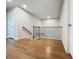 Hallway with wood floors and wooden railings at 2560 Quarterdeck Dr, Cumming, GA 30041