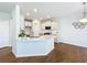 Kitchen featuring an island with white countertops, pendant lighting, stainless steel appliances, and hardwood floors at 2560 Quarterdeck Dr, Cumming, GA 30041