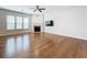 Spacious living room boasts hardwood floors, a fireplace, ample natural light, and neutral tones at 2560 Quarterdeck Dr, Cumming, GA 30041