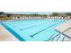 Community pool with clear blue water, lane lines, and plenty of lounge chairs at 2560 Quarterdeck Dr, Cumming, GA 30041