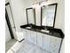 Bright bathroom features double vanity with granite countertop and modern fixtures at 6159 Sable Fox Dr, Riverdale, GA 30296
