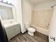 Bathroom featuring a single sink vanity and a tub-shower combination at 6159 Sable Fox Dr, Riverdale, GA 30296