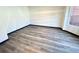 Bright bedroom with new laminate floors and natural light from the window at 6159 Sable Fox Dr, Riverdale, GA 30296